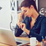 woman-at-desk-suffering-from-eye-strain