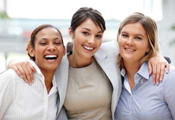 three-smiling-women-hugging