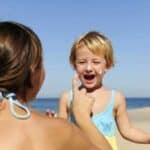 mother-daughter-playing-at-the-beach