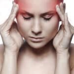 woman-fingers-to-temples-in-pain